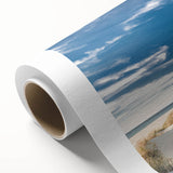 Rolled canvas wall art showcasing a serene beach landscape with vibrant colors, ideal for home decor, shipped in a protective cardboard tube for preservation.