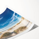 Vibrant rolled wall art print showcasing a serene beach landscape with soft pastel colors, ideal for home decor, packaged securely in a protective tube.