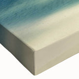 Close-up of a vibrant stretched canvas wall art piece depicting a serene beach landscape, showcasing rich colors and intricate details, perfect for home decor.