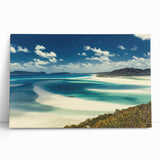 Stretched canvas artwork showcasing a serene beach landscape with vibrant blues and sandy tones, perfect for home decor or beach-themed interiors, leaning against a wall.