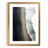 Framed wall art piece showcasing a serene beach landscape with soft waves and golden sand, elegantly presented in a gold frame with a mat, perfect for coastal decor.