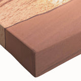 Close-up of a vibrant stretched canvas featuring a serene beach landscape design, showcasing rich blues and sandy tones, ideal for home decor.