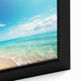 Framed canvas wall art showcasing a vibrant beach landscape with azure waters and golden sands, perfect for enhancing home décor and evoking a serene coastal vibe.