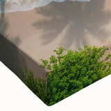 Close-up of a stretched canvas wall art piece showcasing a vibrant beach landscape design, featuring rich blues and sandy tones, ideal for coastal decor.