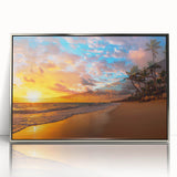 Framed wall art featuring a serene beach landscape with vibrant blue waters and a golden sandy shore, elegantly displayed in a silver frame, perfect for home decor.