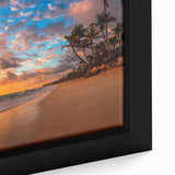 Framed canvas wall art depicting a serene beach landscape at sunset, showcasing vibrant hues of orange and pink in the sky, ideal for home decor.