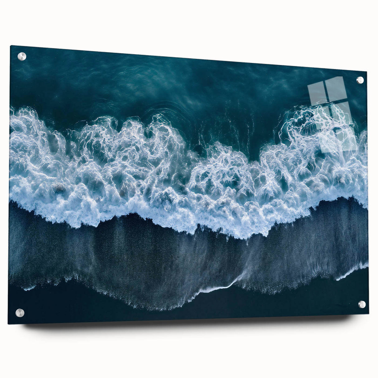 Acrylic glass wall art showcasing a serene beach landscape design with vibrant blue hues and natural textures, displayed in a modern side view with decorative pins.