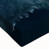 Close-up of a stretched canvas wall art piece showcasing a serene beach landscape with vibrant colors and intricate details, perfect for home decor enhancement.