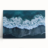 Vibrant stretched canvas artwork depicting a serene beach landscape with gentle waves and a clear blue sky, perfect for home decor or coastal-themed interiors.