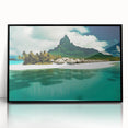 Framed acrylic wall art showcasing a serene beach landscape with vibrant colors, featuring a black frame that enhances the coastal scene's tranquility. Ideal for home decor enthusiasts seeking a calming coastal aesthetic.
