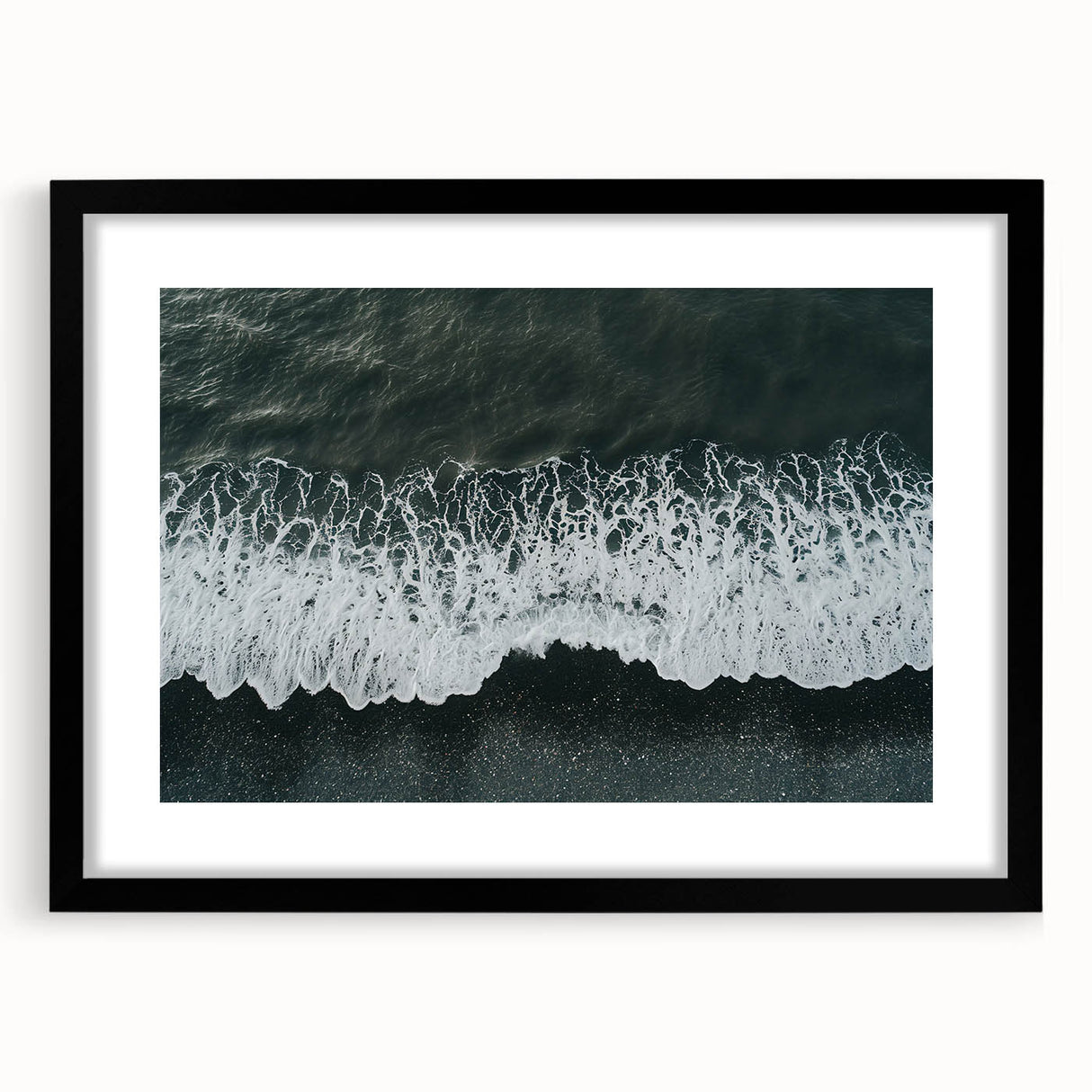 Framed wall art showcasing a serene beach landscape with vibrant colors, set in a sleek black frame with a mat, perfect for enhancing home decor.