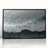 Framed acrylic wall art showcasing a serene beach landscape, featuring soft blue waves and golden sand, presented in a sleek black frame for modern decor. Ideal for coastal home styling.