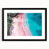 Framed wall art featuring a serene beach landscape with vibrant blue skies and gentle waves, presented in a sleek black frame with a white mat, ideal for home decor.