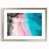 Framed wall art showcasing a serene beach landscape with vibrant colors, set in a sleek silver frame with a white mat, ideal for coastal-themed decor.