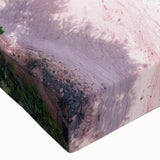 Close-up of a stretched canvas wall art piece showcasing a vibrant beach landscape with vivid blues and greens, perfect for home decor and relaxation.