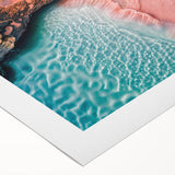 Vibrant rolled canvas depicting a serene beach landscape with soft waves and a colorful sunset, perfect for adding a calming touch to home decor.