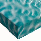 Close-up of a vibrant stretched canvas wall art piece depicting a serene beach landscape, featuring rich blues and sandy tones, perfect for coastal decor enthusiasts.