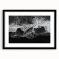 Framed wall art featuring a serene beach landscape with soft waves and a clear blue sky, presented in a stylish black frame with a white mat for a sophisticated look.