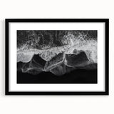 Framed wall art featuring a serene beach landscape with soft waves and a clear blue sky, presented in a stylish black frame with a white mat for a sophisticated look.