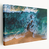Stretched canvas wall art depicting a serene beach landscape at sunset, featuring soft pastel colors and calming waves, ideal for coastal decor enthusiasts.