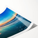 Vibrant rolled print of a serene beach landscape, showcasing soft waves and golden sands under a bright blue sky, ideal for home decor or relaxation.