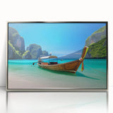 Framed wall art featuring a serene beach landscape, surrounded by a silver acrylic frame, showcasing vibrant colors and tranquil ocean waves, perfect for home decor.