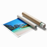 Vibrant rolled print of a serene beach landscape, showcasing soft waves and golden sand under a clear blue sky, ideal for coastal-themed decor.