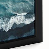 Close-up of a beautifully framed canvas featuring a serene beach landscape, showcasing vibrant colors and intricate details of the ocean waves and sandy shore, perfect for home decor.