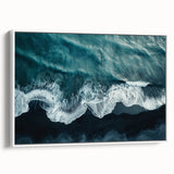 Framed canvas artwork depicting a serene beach landscape with vibrant colors, showcasing gentle waves and a clear sky, perfect for home decor.