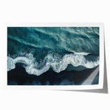 Vibrant rolled print of a serene beach landscape, showcasing soft waves and golden sand under a bright blue sky, perfect for coastal home decor.