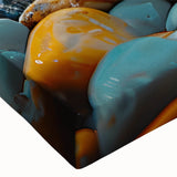 Close-up of a vibrant stretched canvas wall art piece depicting a serene beach landscape with soft waves and colorful sunset hues, perfect for home decor.