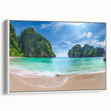 Framed canvas wall art showcasing a serene beach landscape with vibrant colors and intricate details, displayed with a white frame, perfect for home decor.