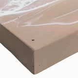 Close-up of a vibrant stretched canvas wall art piece showcasing a serene beach landscape with soft waves and golden sands, perfect for coastal decor enthusiasts.