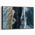 Framed canvas wall art showcasing a serene beach landscape, featuring vibrant colors and intricate details, displayed from a side view against a neutral background.