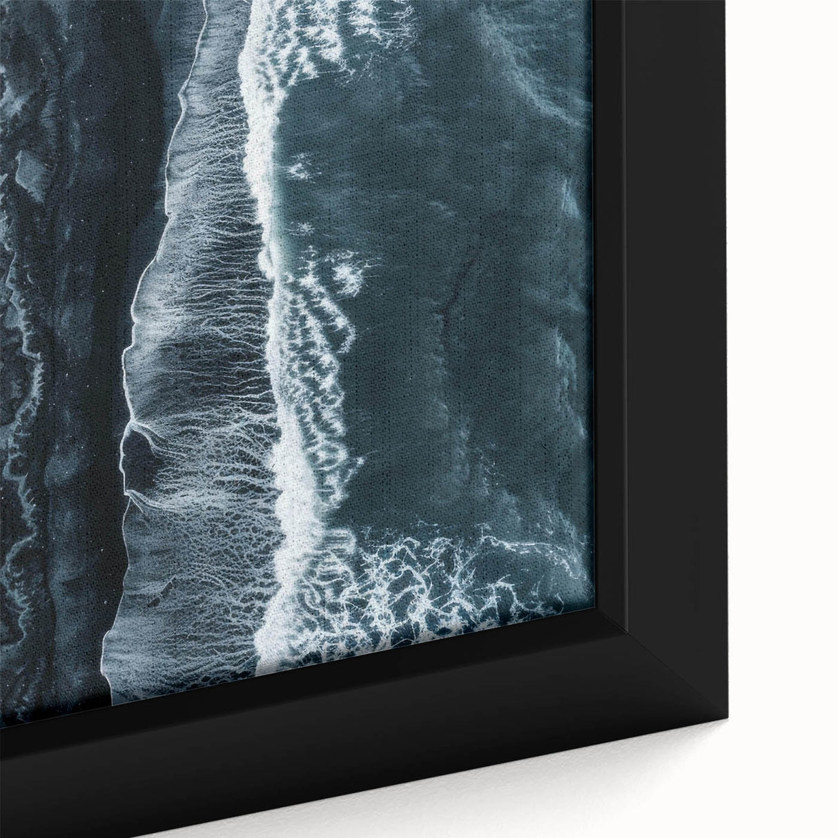 Framed canvas wall art showcasing a vibrant beach landscape with vivid blues and sandy tones, perfect for enhancing coastal-themed decor in living spaces.