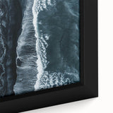 Framed canvas wall art showcasing a vibrant beach landscape with vivid blues and sandy tones, perfect for enhancing coastal-themed decor in living spaces.