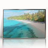 Framed wall art showcasing a serene beach landscape with vibrant colors, set in a sleek silver frame, perfect for enhancing modern home decor.