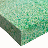 Close-up of a vibrant stretched canvas wall art piece showcasing a serene beach landscape with soft waves and a colorful sunset, perfect for home decor.