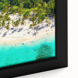 Close-up of a framed canvas wall art piece showcasing a vibrant beach landscape design, featuring bright blues and sandy tones, ideal for home decor.
