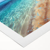 Vibrant rolled canvas wall art depicting a serene beach landscape at sunset, showcasing soft pastel colors and gentle waves, ideal for home decor.