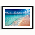 Framed wall art collection showcasing a serene beach landscape with soft blue and sandy tones, featuring a black frame and white mat for an elegant presentation. Perfect for enhancing coastal-themed decor in living spaces or offices.