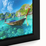 Framed canvas wall art showcasing a vibrant beach landscape with vivid blues and sandy tones, capturing serene ocean waves and a bright sky, perfect for coastal decor.