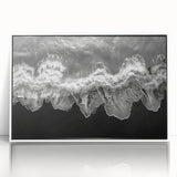 Framed acrylic wall art displaying a serene beach landscape with soft blue skies and golden sands, ideal for coastal-themed home decor.