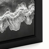 Framed canvas wall art showcasing a vibrant beach landscape with blue ocean waves and golden sand, perfect for enhancing home decor and creating a tranquil atmosphere.