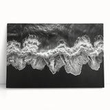 Stretched canvas wall art featuring a serene beach landscape with soft pastel colors, leaning against a textured wall, perfect for coastal decor enthusiasts.