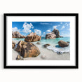 Framed wall art showcasing a serene beach landscape design, featuring vibrant colors and intricate details, set in a sleek black frame with a mat for an elegant finish. Perfect for enhancing coastal-themed decor in living rooms or offices.