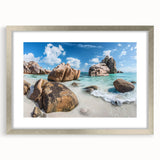 Framed wall art showcasing a serene beach landscape in soft pastel colors, accented with a silver mat and frame, ideal for enhancing home decor.