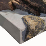 Close-up of a vibrant stretched canvas wall art piece depicting a serene beach landscape with vivid colors, perfect for home decor and relaxation themes.