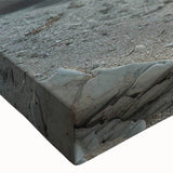 Close-up of a stretched canvas wall art piece showcasing a vibrant beach landscape design, featuring vivid blues and sandy tones, perfect for coastal home decor.