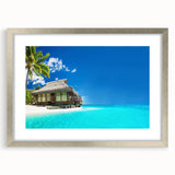 Framed wall art featuring a serene beach landscape design with soft pastel colors, encased in a sleek silver frame with a white mat, ideal for coastal decor.